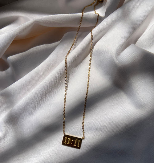 Gold anti tarnish necklace with a 11:11 pendant 