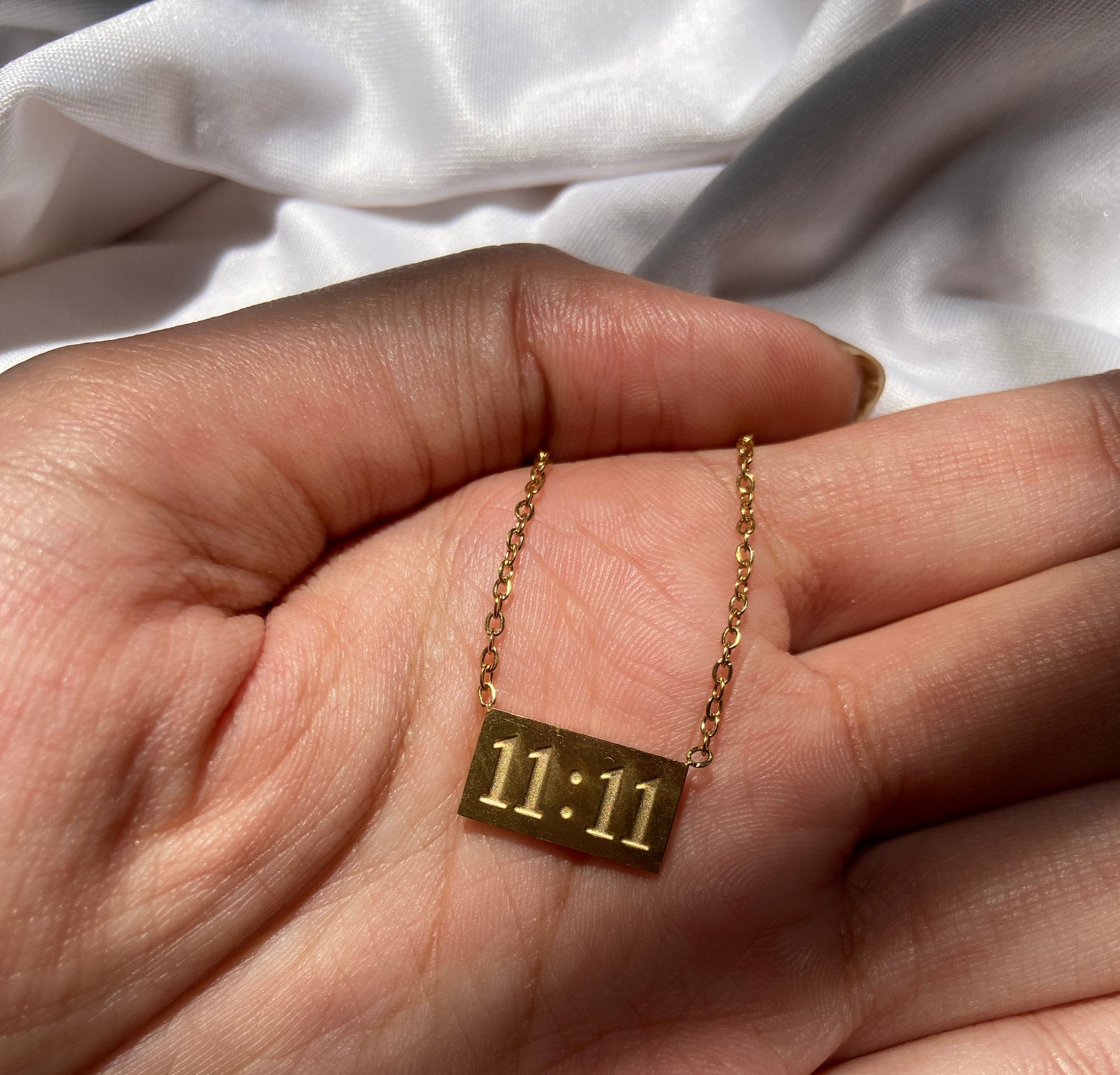 Gold anti tarnish necklace with a 11:11 pendant 
