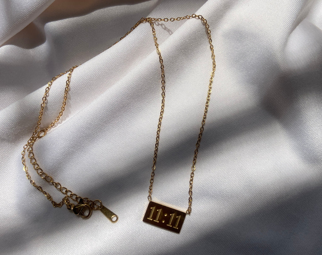 Gold anti tarnish necklace with a 11:11 pendant 