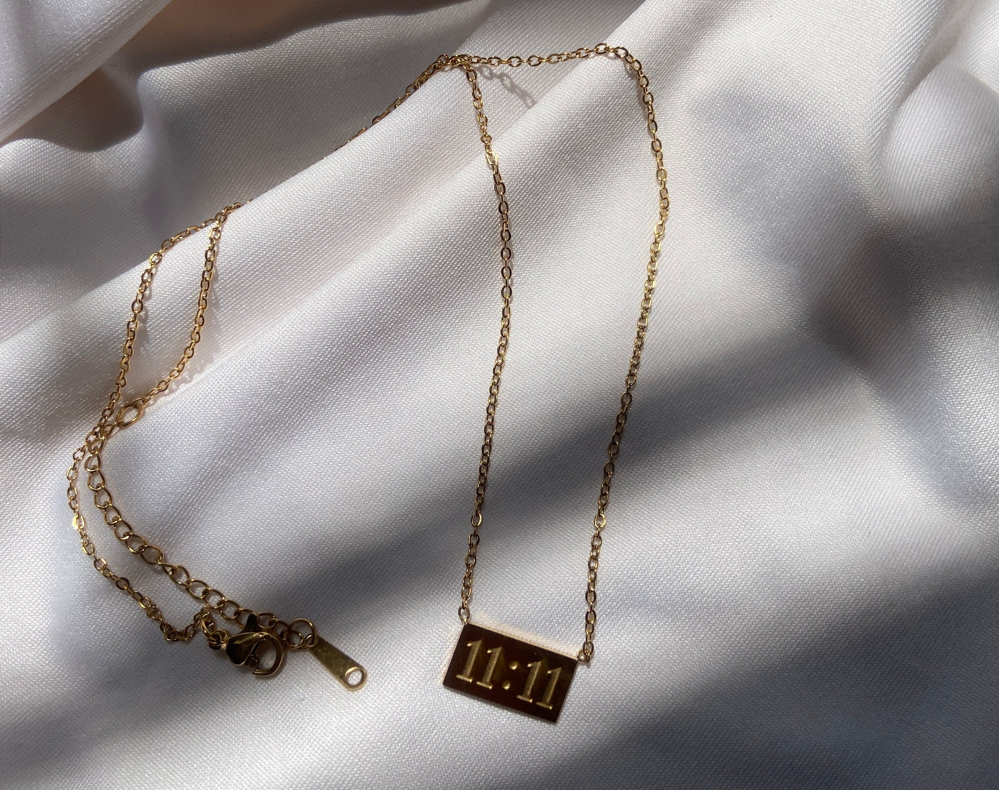Gold anti tarnish necklace with a 11:11 pendant 